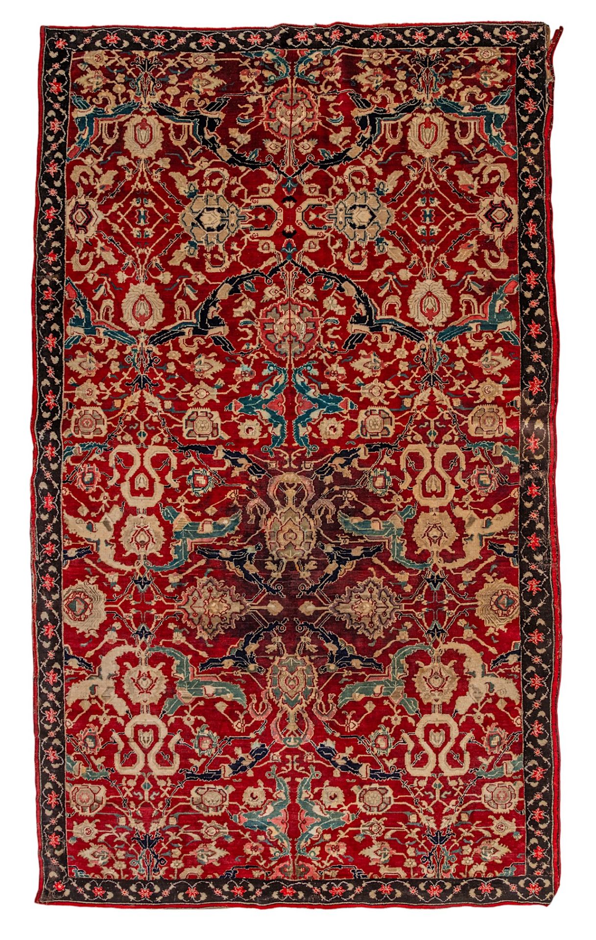 An Oriental rug, decorated with floral motifs, 210 x 355 cm