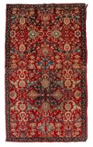 An Oriental rug, decorated with floral motifs, 210 x 355 cm