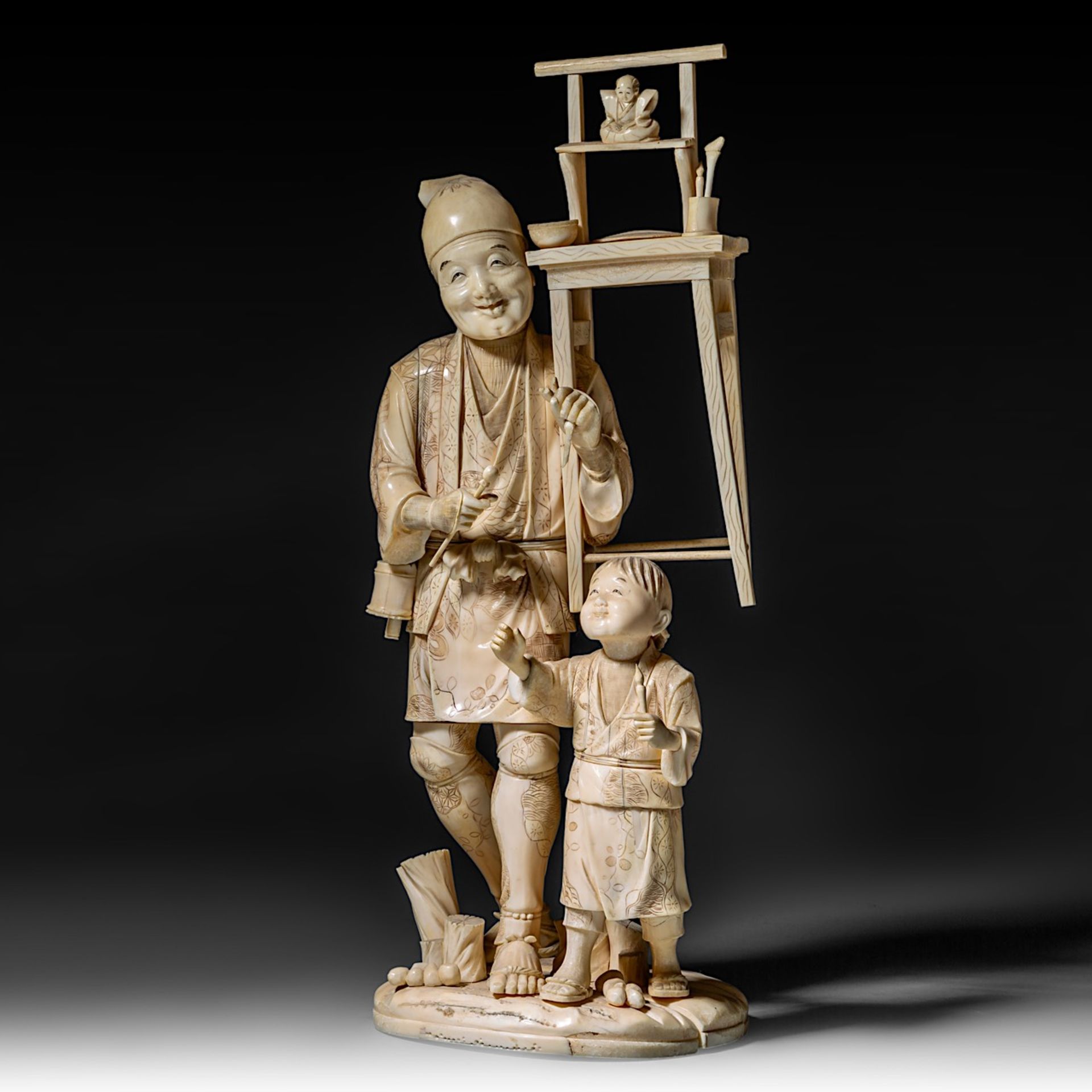 A large Japanese walrus ivory okimono of an artisan with his son, Meiji period (1868-1912), H 46,5 - - Image 2 of 13