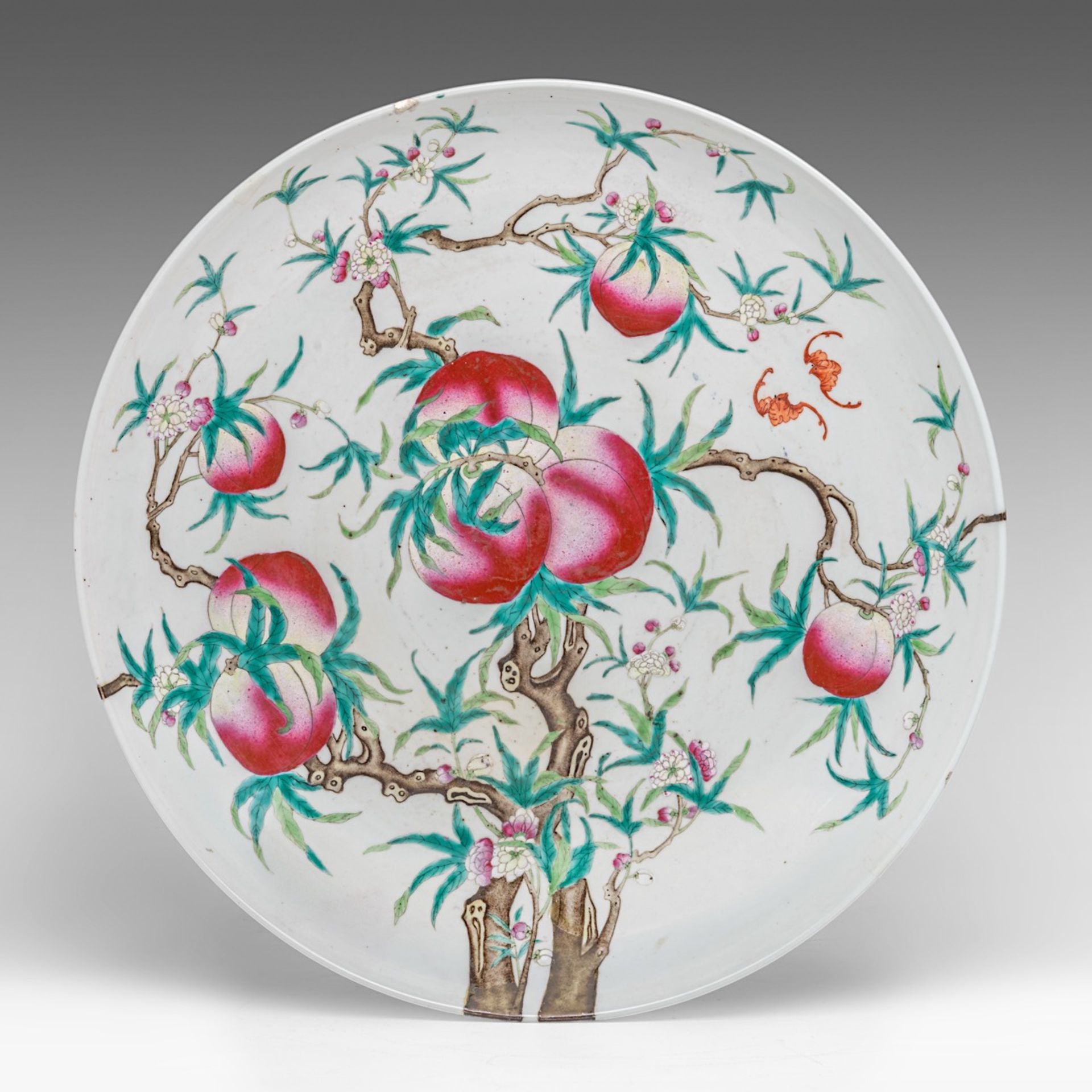 A large Chinese 'Nine Peaches' plate, with a Qianlong mark, Guangxu period, dia 47 cm