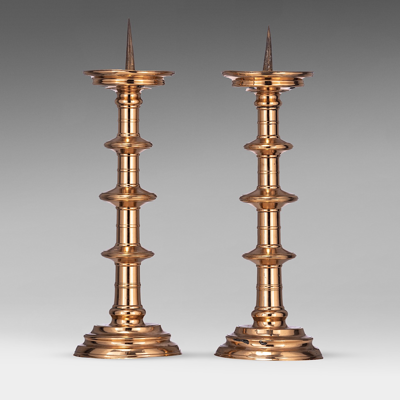 A pair of pricket candlesticks, 16thC, H 55 - 56 cm