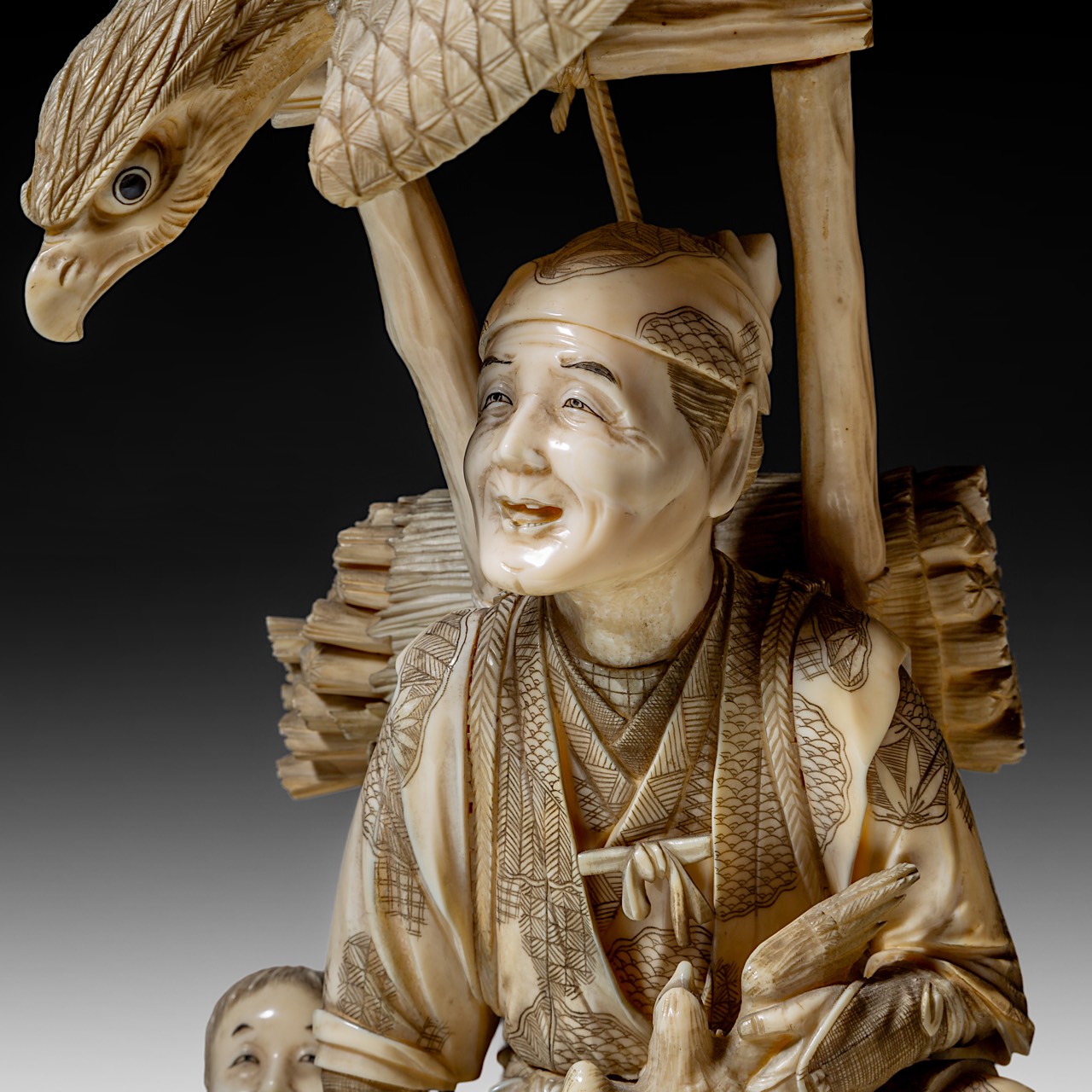 A large and fine Japanese walrus ivory okimono of a falconer and his son watching an eagle, Meiji pe - Image 12 of 13