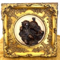 2 Bronze angels on marmory plate Framed in a Gold frame