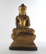 Buddha, Burma, 19. Jh., Holz, geschnitzt, schwarz gefasst und vergoldet, im Meditationssitz auf Soc