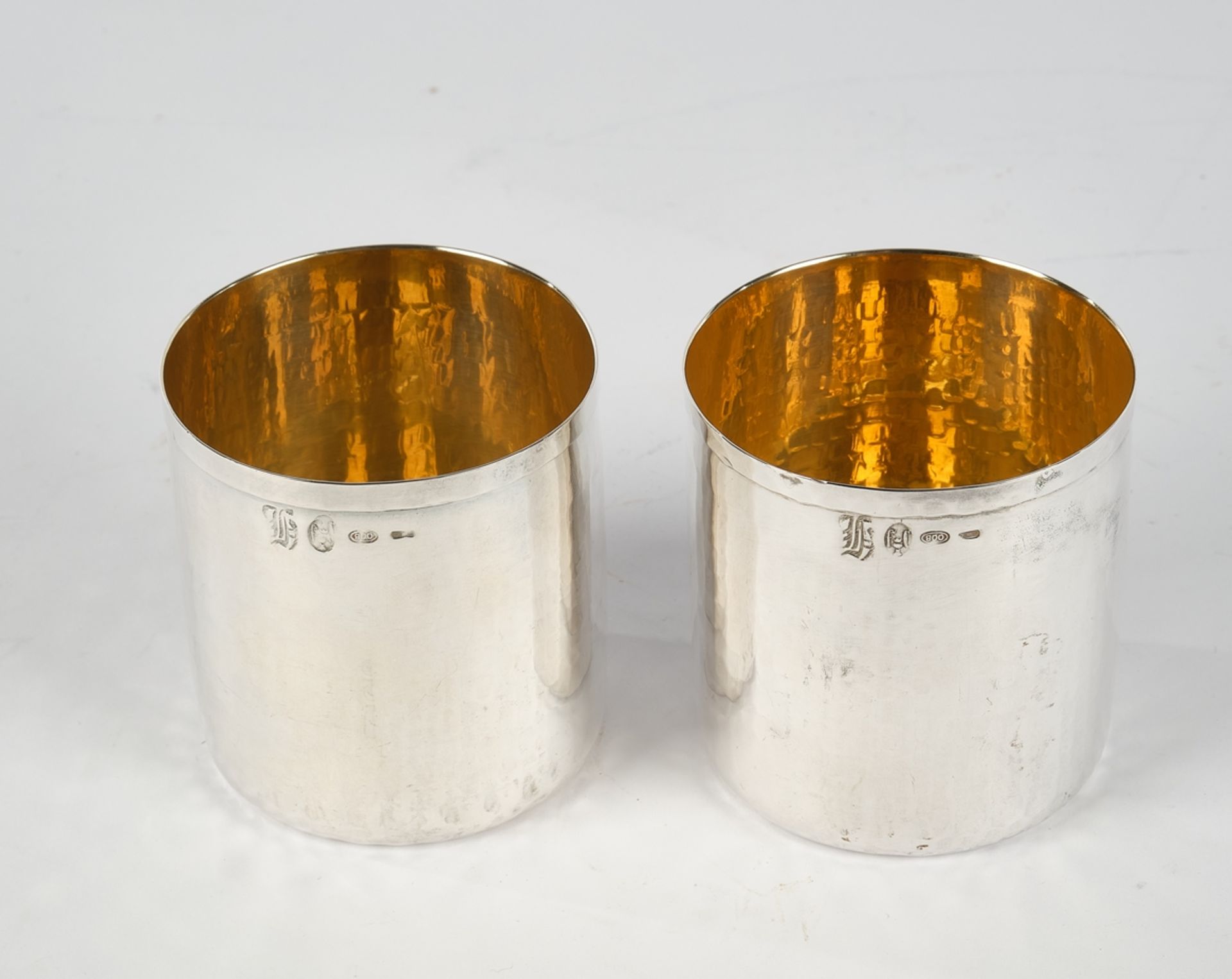 Pair of beakers, silver 800, Italy, marbled structure, gilded inside, 7.8 cm high, together approx.