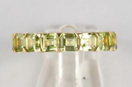 Memoire-Ring, GG 750, 16 Peridots zus. ca. 5.20 ct., 3.94 g, RM 54