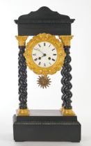 Portal clock, late 19th century, matt black wooden case, four columns, capitals, bases and relief b