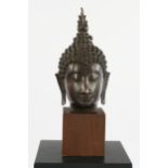 Buddha head, Thailand, modern, bronze, patinated, mounted on a wooden base, 28.5 cm or 40 cm high (