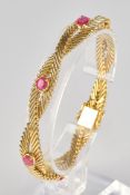 Armband, GG 750, 6 Rubine, oval geschliffen, zus. ca. 3.00 ct., ca. 38.2 g