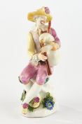 Porzellanfigur, "Harlekin mit Dudelsack", Meissen, Schwertermarke, 18. Jh., polychrom und goldstaff