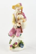 Porcelain figure, , "Harlequin with bagpipes", Meissen, sword mark, 18th century, polychrome and go