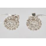 Pair of stud earrings, WG 750, 50 brilliant-cut diamonds and diamonds totalling approx. 0.74 ct, ap