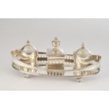 Desk set, silver, 19th century, oval frame with latticework, mounted central lidded box, inkwell in