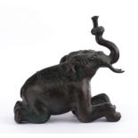 Sculpture, , "Reclining elephant", India, 20th/21st century, metal, dark patina, 22 cm high