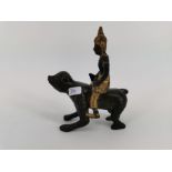 FIGURE / BRONZE SCULPTURE: Man riding a monkey, Thailand, bronze, partially painted in gold colour