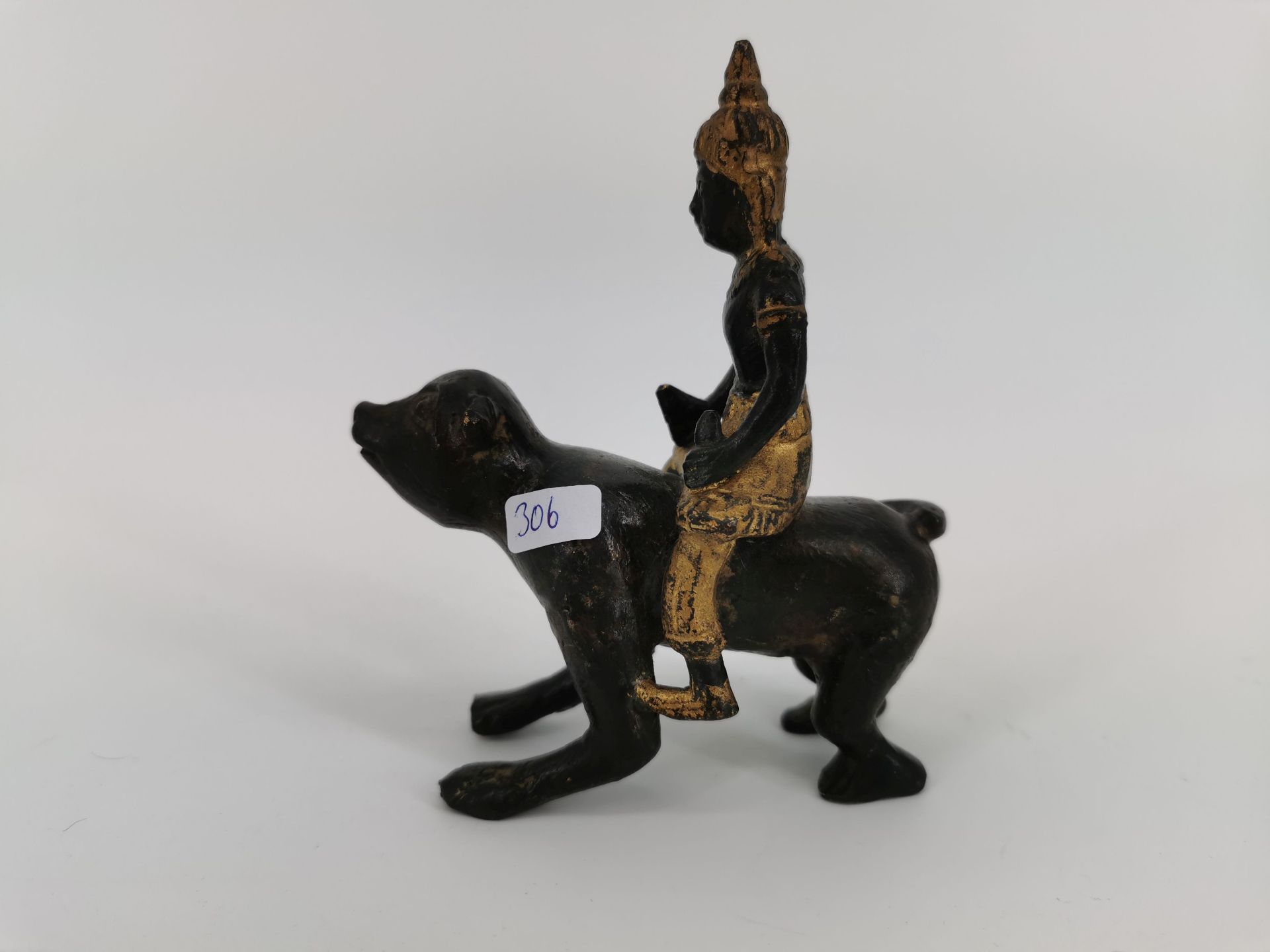 FIGURE / BRONZE SCULPTURE: Man riding a monkey, Thailand, bronze, partially painted in gold colour