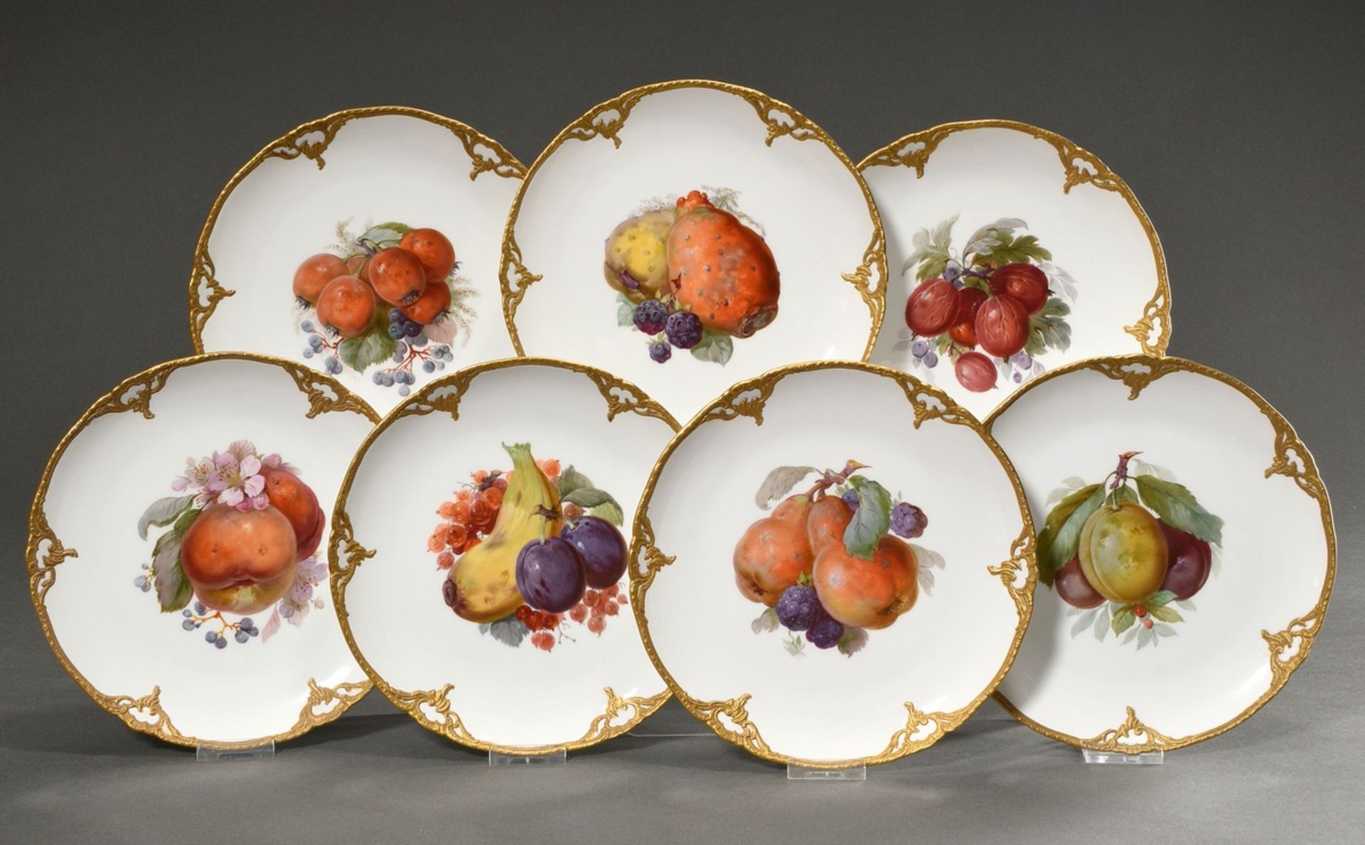 7 Various KPM plates with gilded relief bisque porcelain Rocaille rim, polychrome soft painting "fr