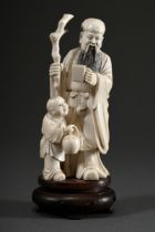 Ivory group "Taoist sage with servant", standing bearded man with knotted staff and square cups and