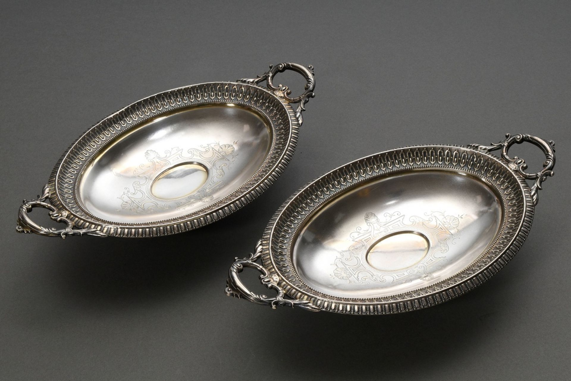 A pair of late Biedermeier top bowls in oval form with engraved ornamental decoration and sculpted 