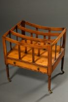 Canterbury newspaper rack in a simple design with drawer in the base, fruitwood, England around 190