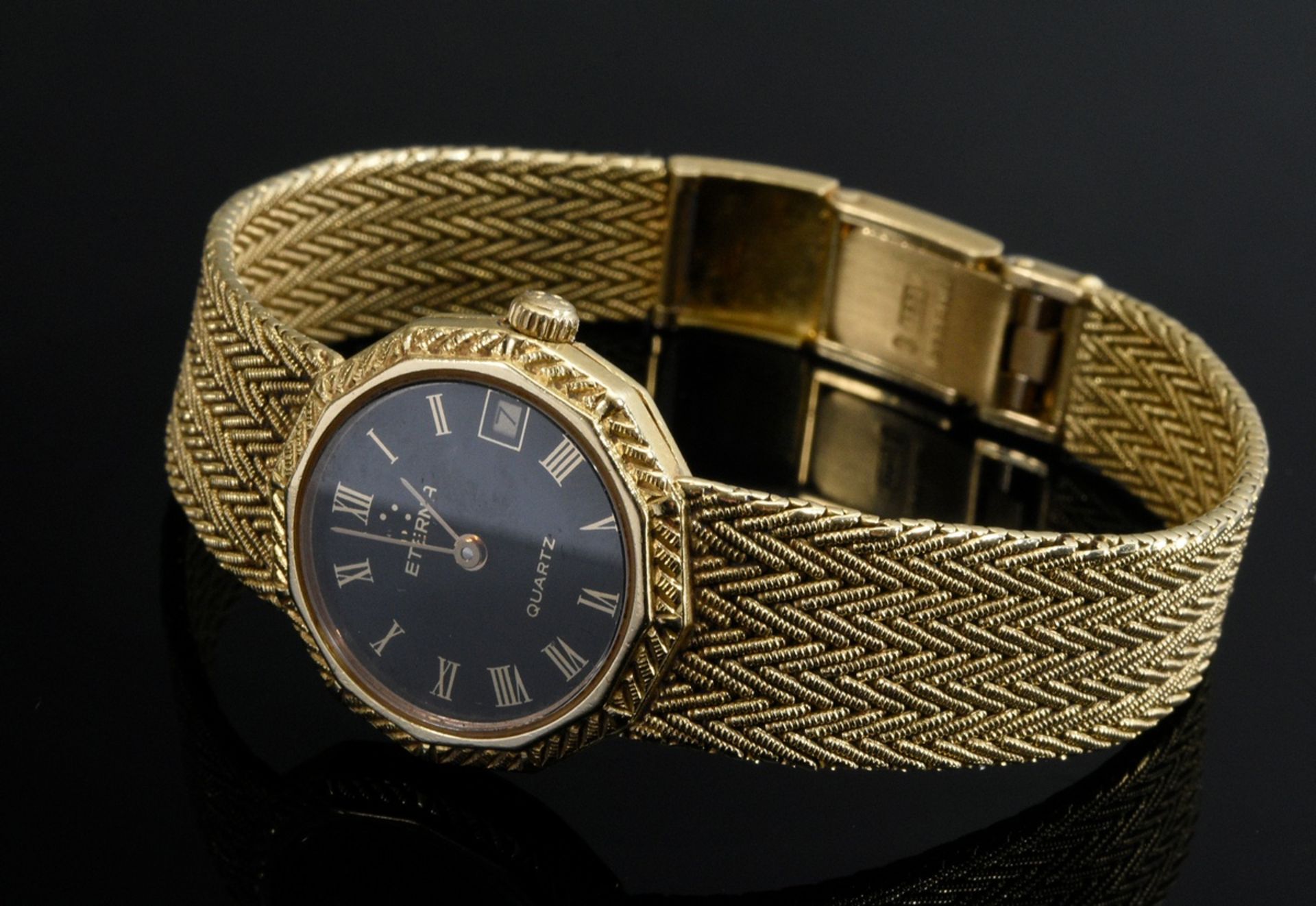 Eterna yellow gold 750 ladies' wristwatch with braided bracelet, quartz, black dial, date, Roman nu