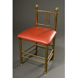 Brass fireside chair with red leather upholstery and tenon finials, England around 1900, h. 47.5/77