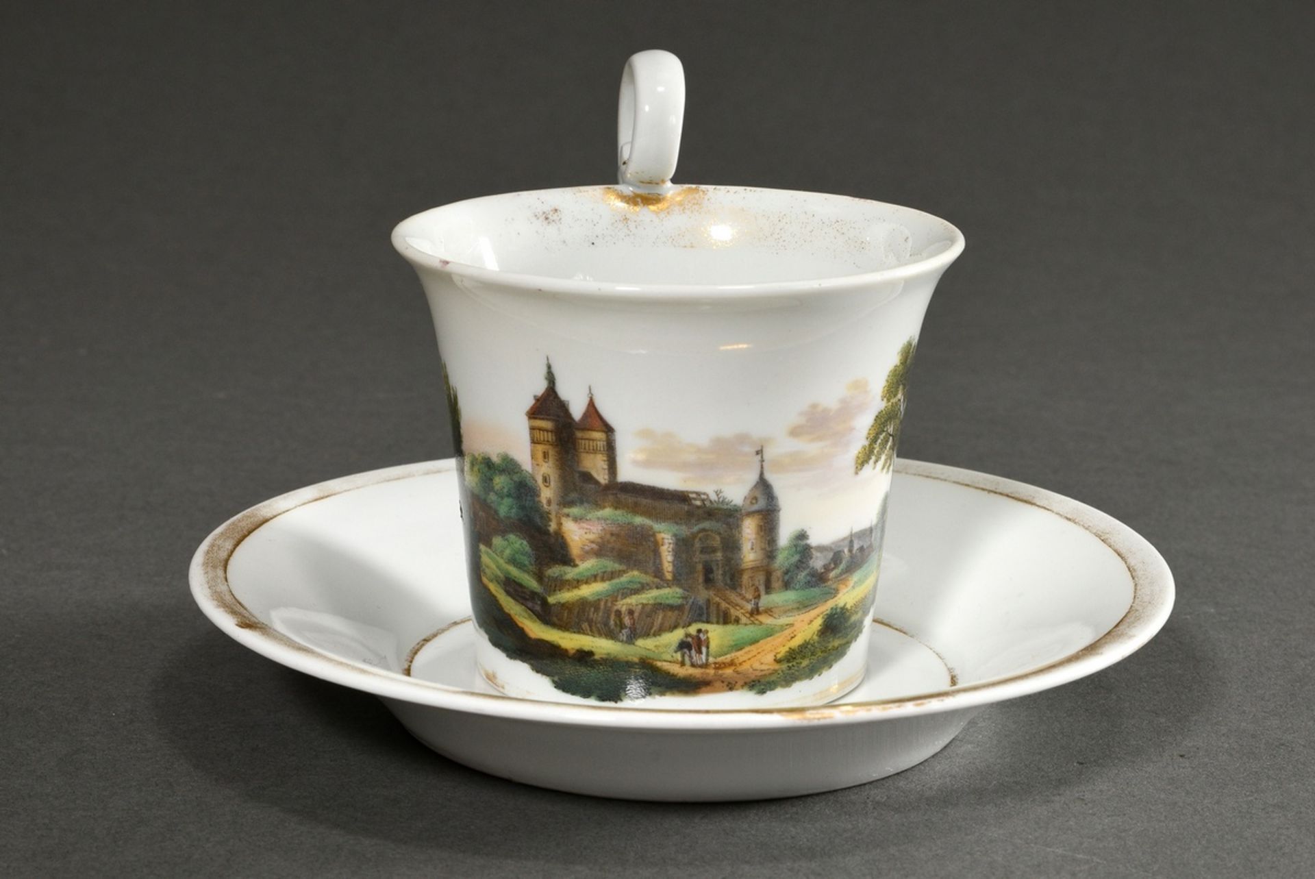 Meissen Biedermeier cup/saucer with flawless depiction of "Stolpen", 19th c., h. 9cm, rubbed gold r