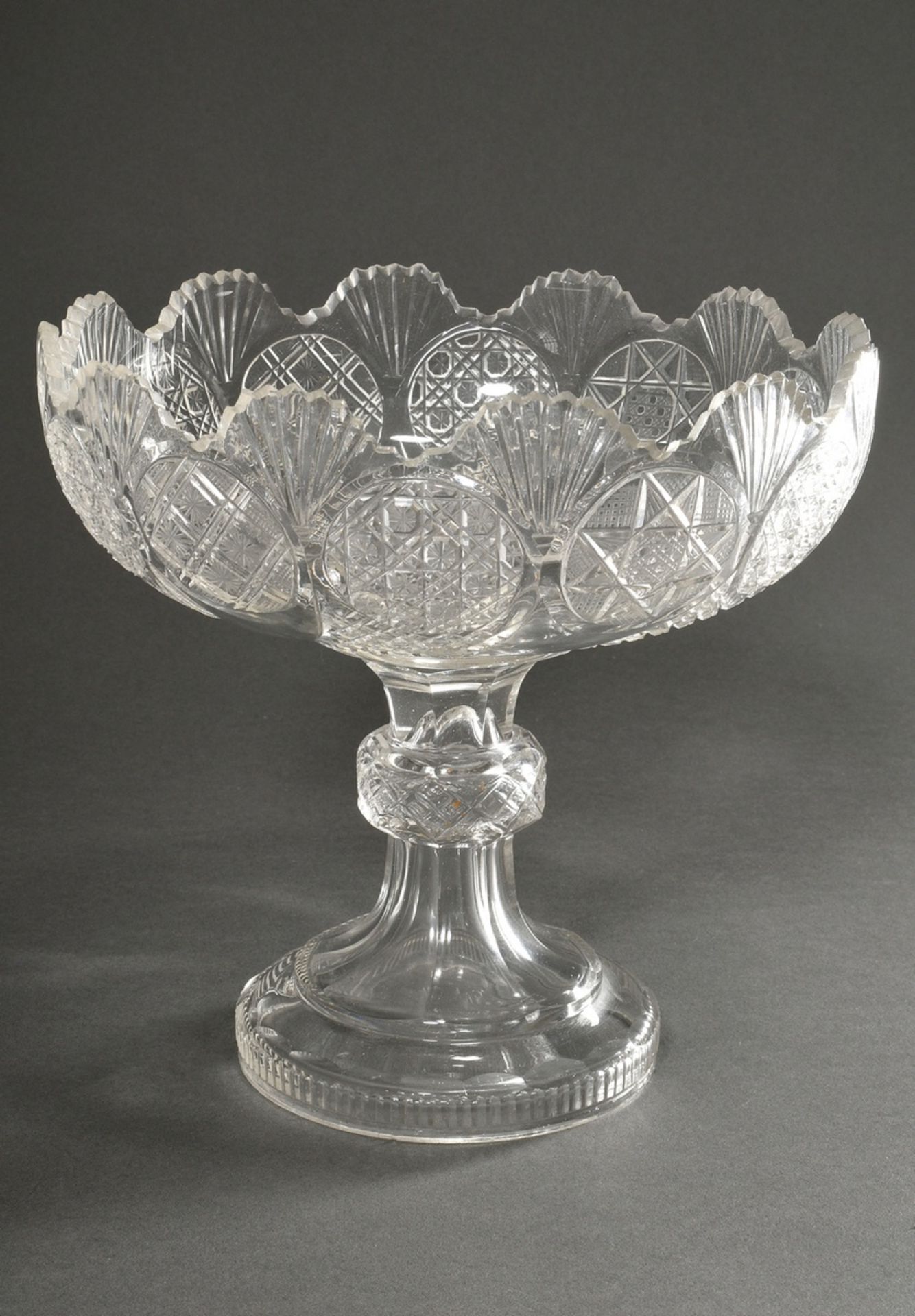 A crystal bowl with various cut fondi in a surrounding frieze and palmette rim over a round foot an