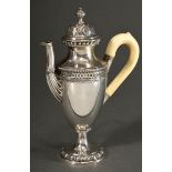 Decorative antique mocha pot on high foot with embossed egg-shaped mouldings on foot and lid as wel