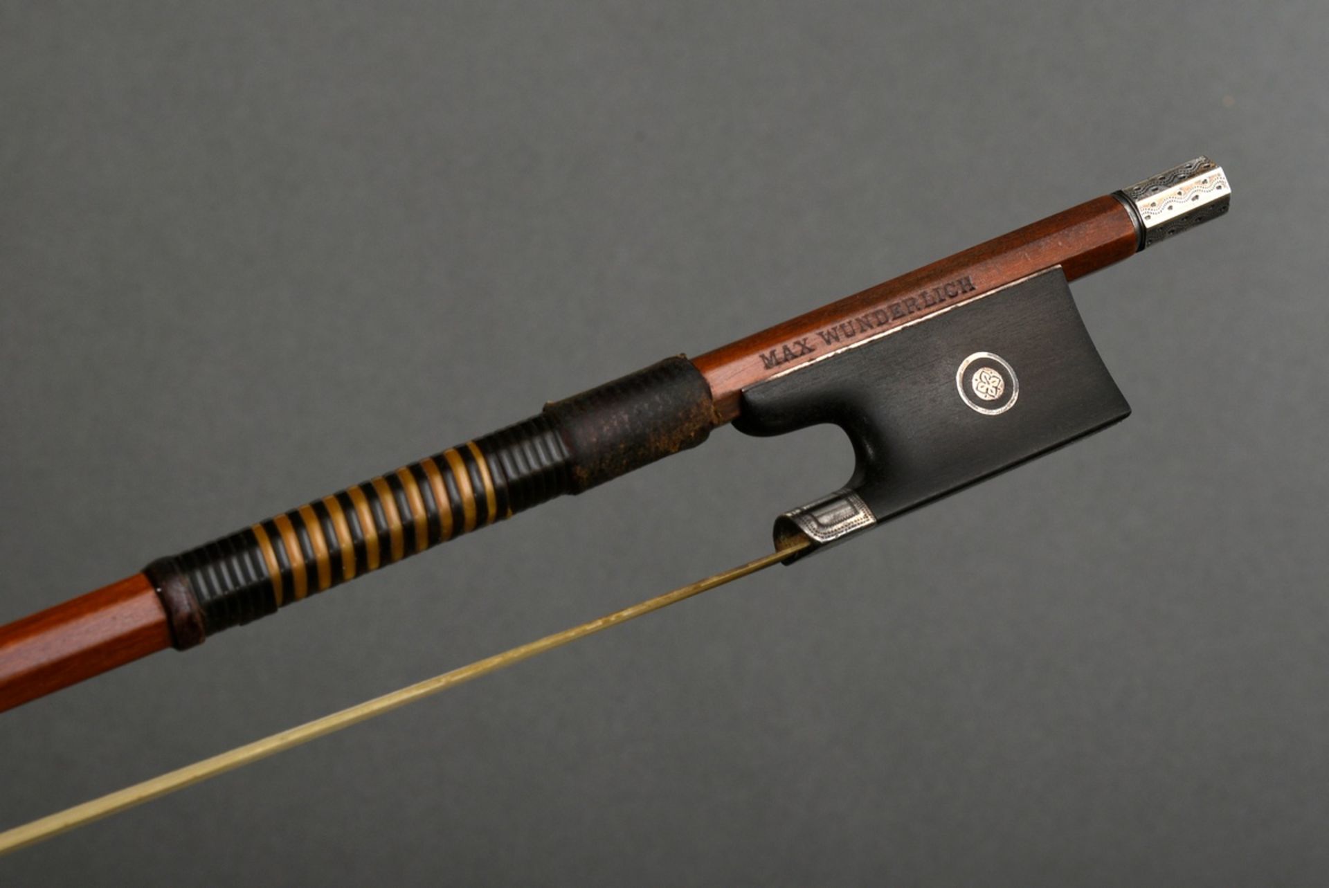 Masterly violin bow, stamped "Max Wunderlich", Germany 1st half 20th c., finely chased silver fitti