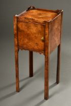 Delicate burl wood bedside cabinet in antique style with one-door compartment on high legs, England