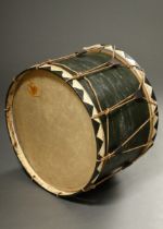 Large military bass drum with green coloured case, rope bracket and black/white coloured tension ri