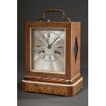 Biedermeier travel clock in wooden case with floral inlays and varnish mouldings and ornamented bro