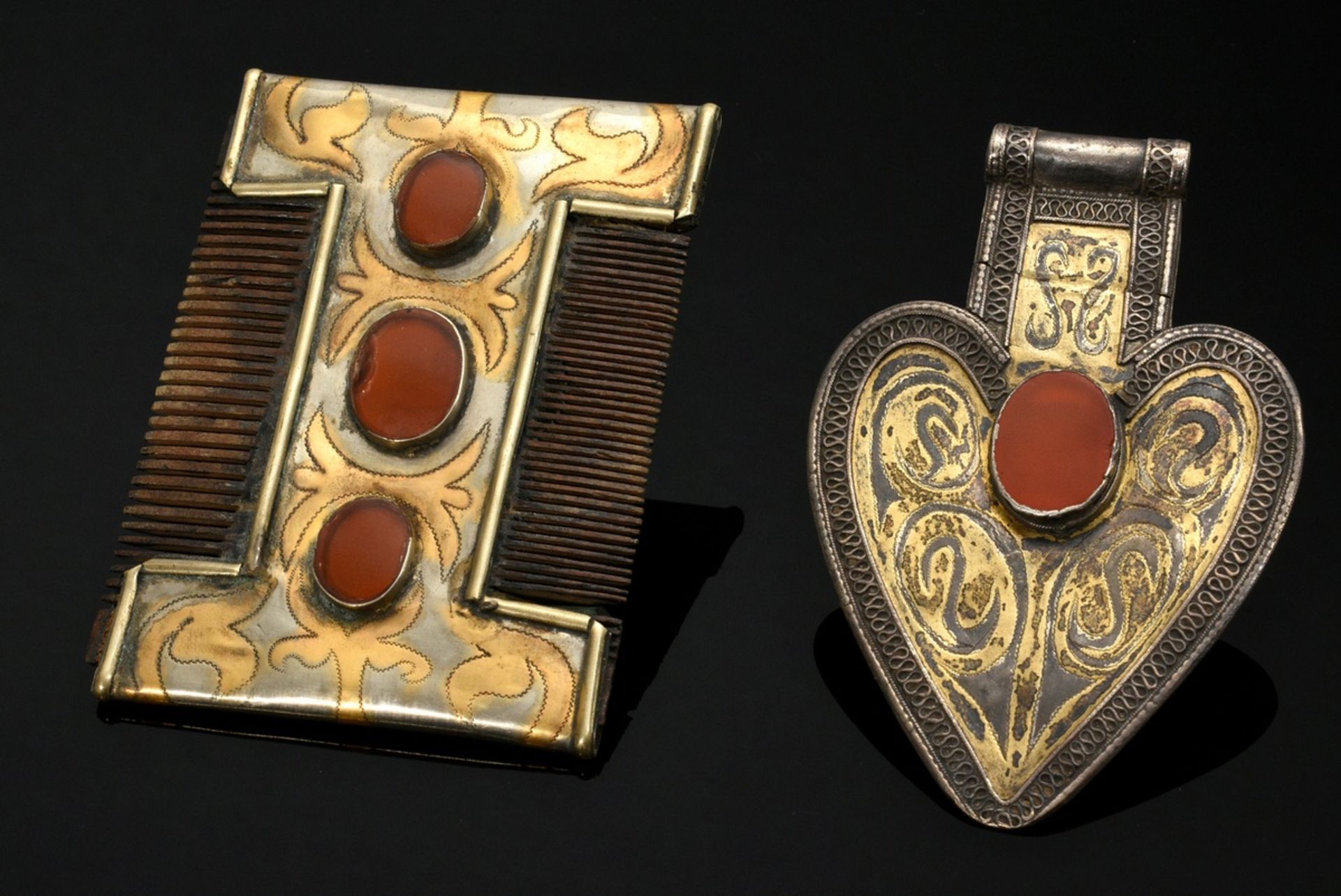 2 Pieces Tekke Turkmen comb and "Asyk" pendant, vegetal fire-gilt silver with carnelian, glass plat