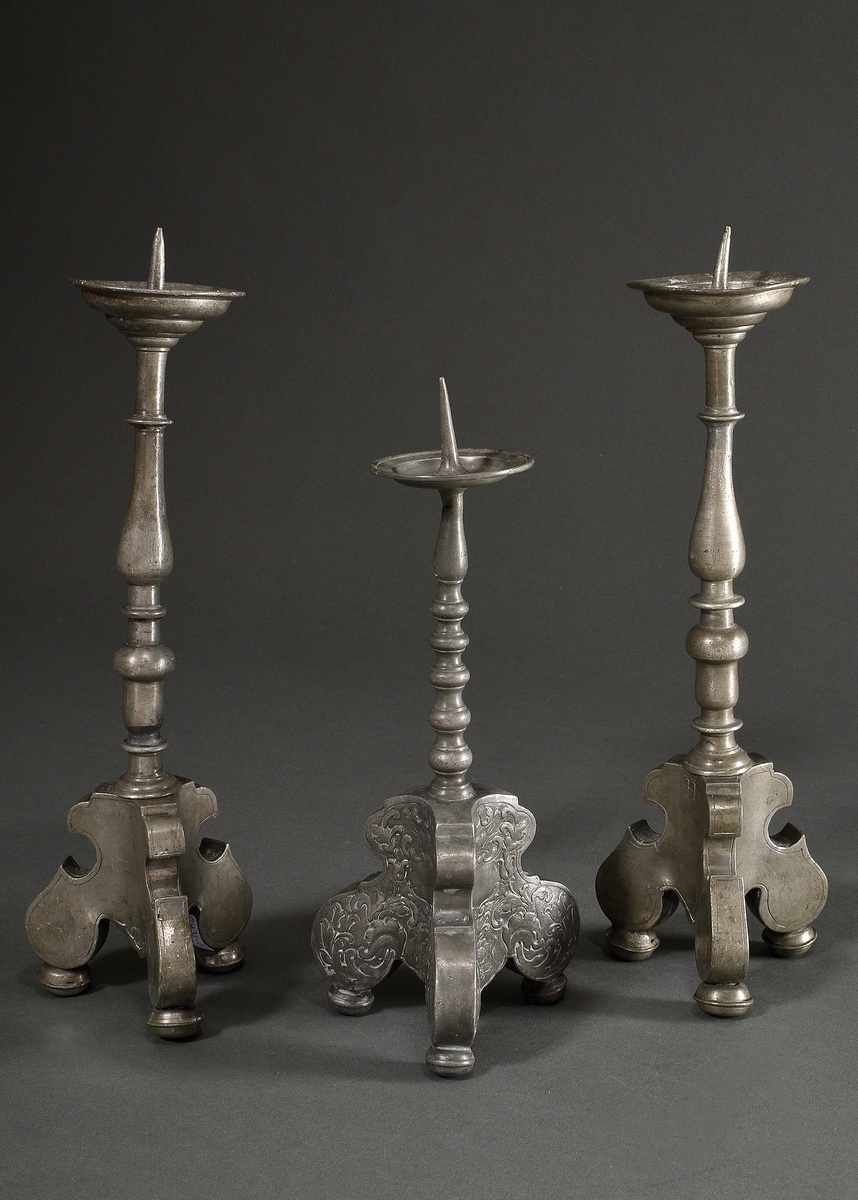 3 various baroque pewter candlesticks with baluster shaft over tripod and spike over protruding dri