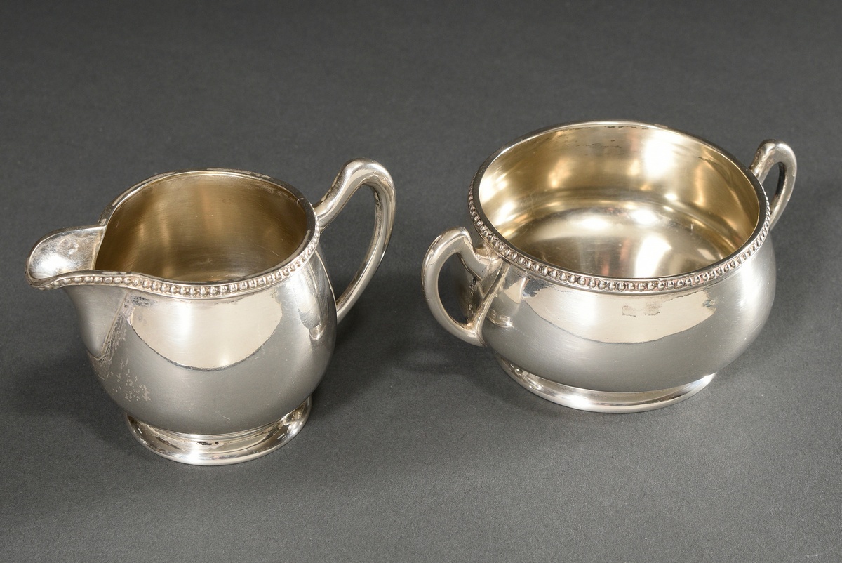 2-piece squat sugar and cream set with beaded rim and drawn handles, silver 800, 188g, h. 5.3/6.3cm