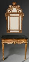 Two-piece opulent Louis XVI console with black marble top and matching mirror, c. 1760/1770, carved