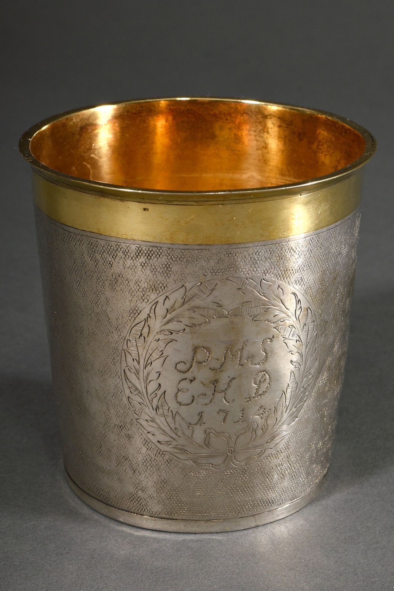 A twisted snakeskin cup with vermeil rim and engraved foliate cartouche "PMS EKD 1714", MM: Thomas 