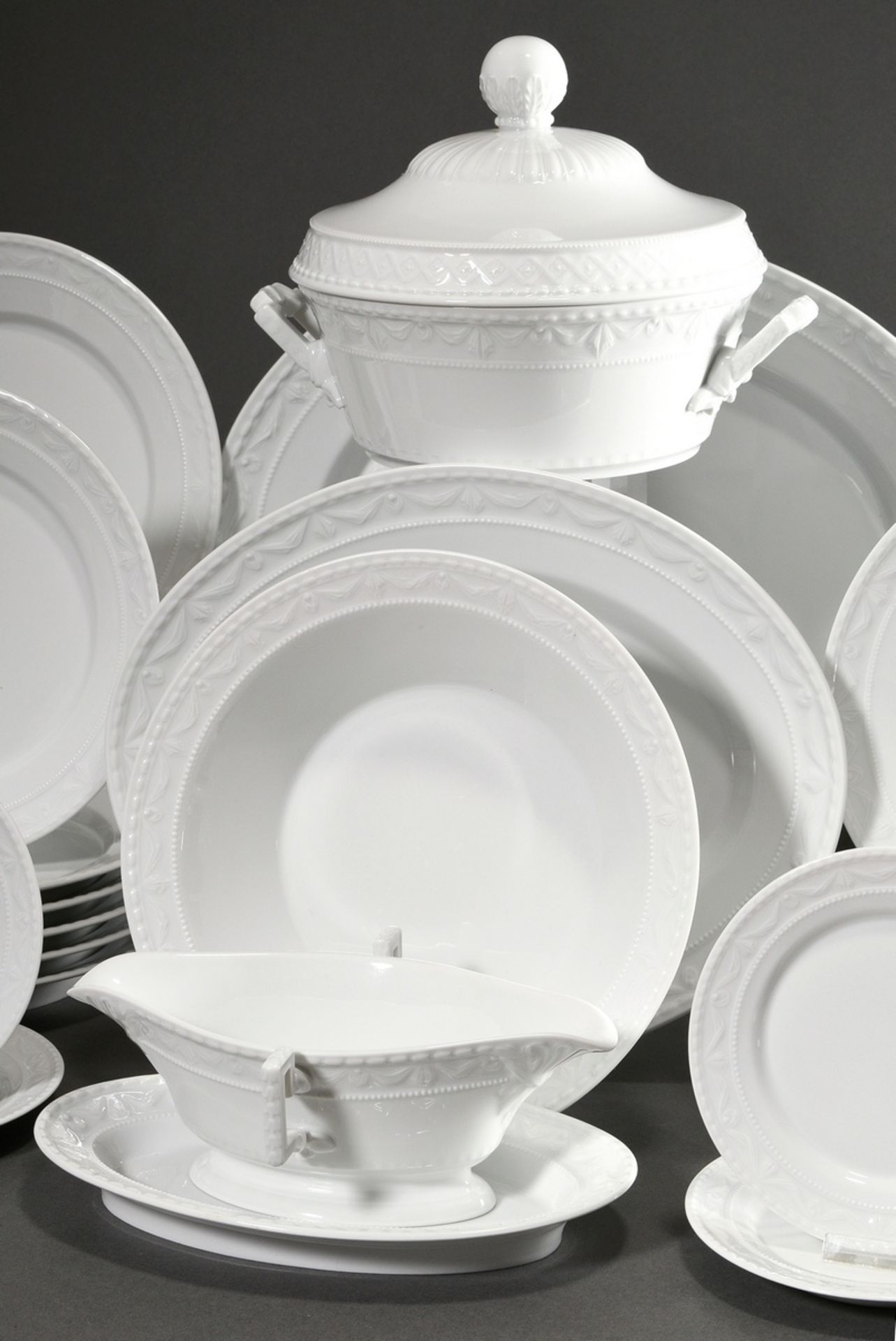 53 Pieces KPM dinner service "Kurland white" with relief border, consisting of: 14 dinner plates (Ø