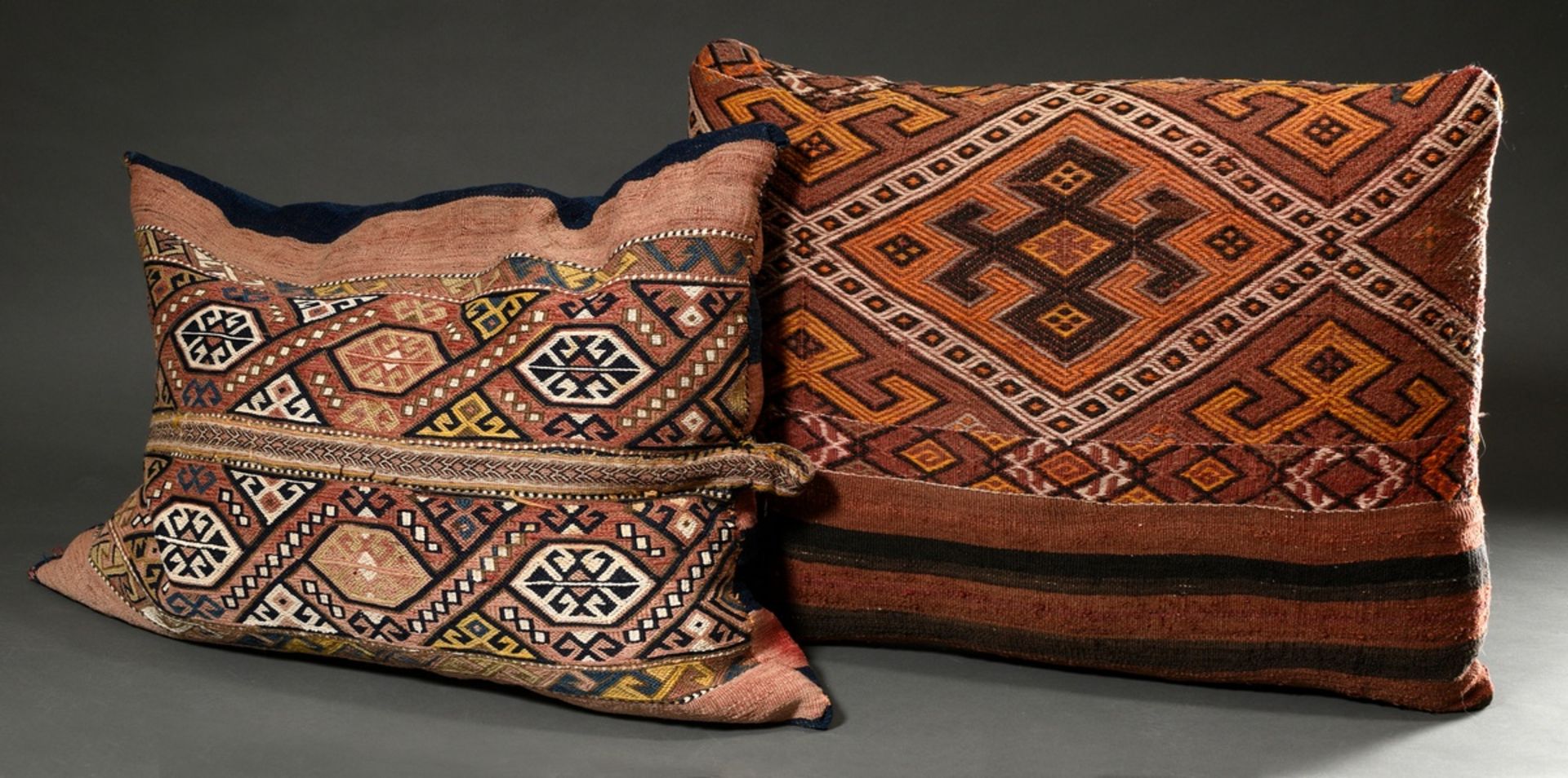 2 Various large decorative Kelim cushions with graphic pattern made of camel bag and hanging fragme