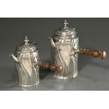 2 various pewter chocolateries with conical body, curved features and wooden handles on the sides, 