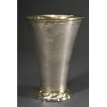 Conical beaker with ornamental engraving and dotted owner's monogram on a domed foot with curved fe