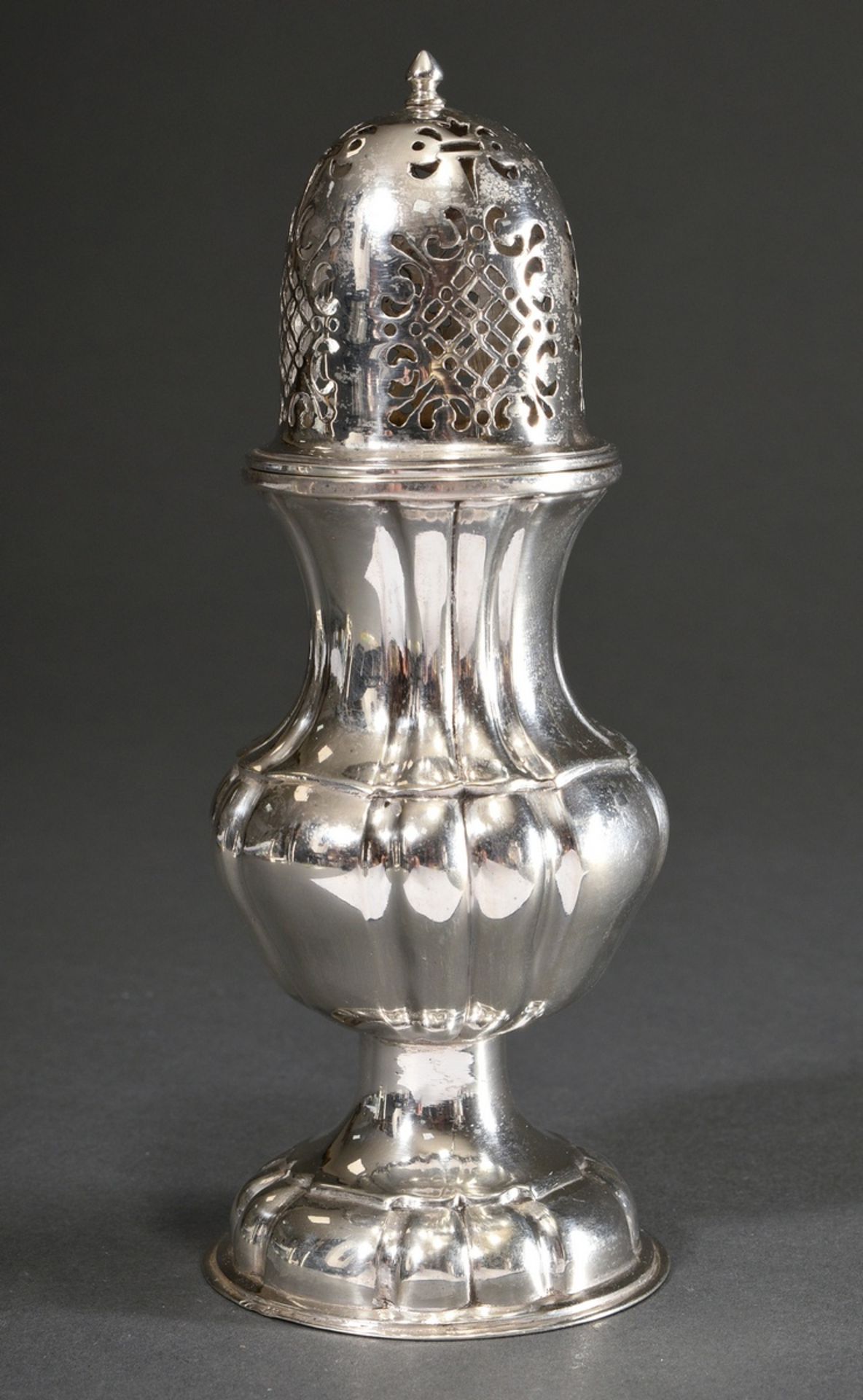 Sugar shaker with gadrooned wall in baroque façon with ornamentally pierced lid, German, silver 800