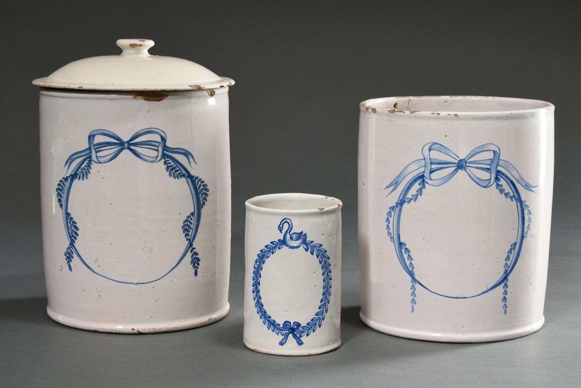 3 Various cylindrical faience pharmacy vessels with blue painted cartouches, c. 1800, 1x with lid, 