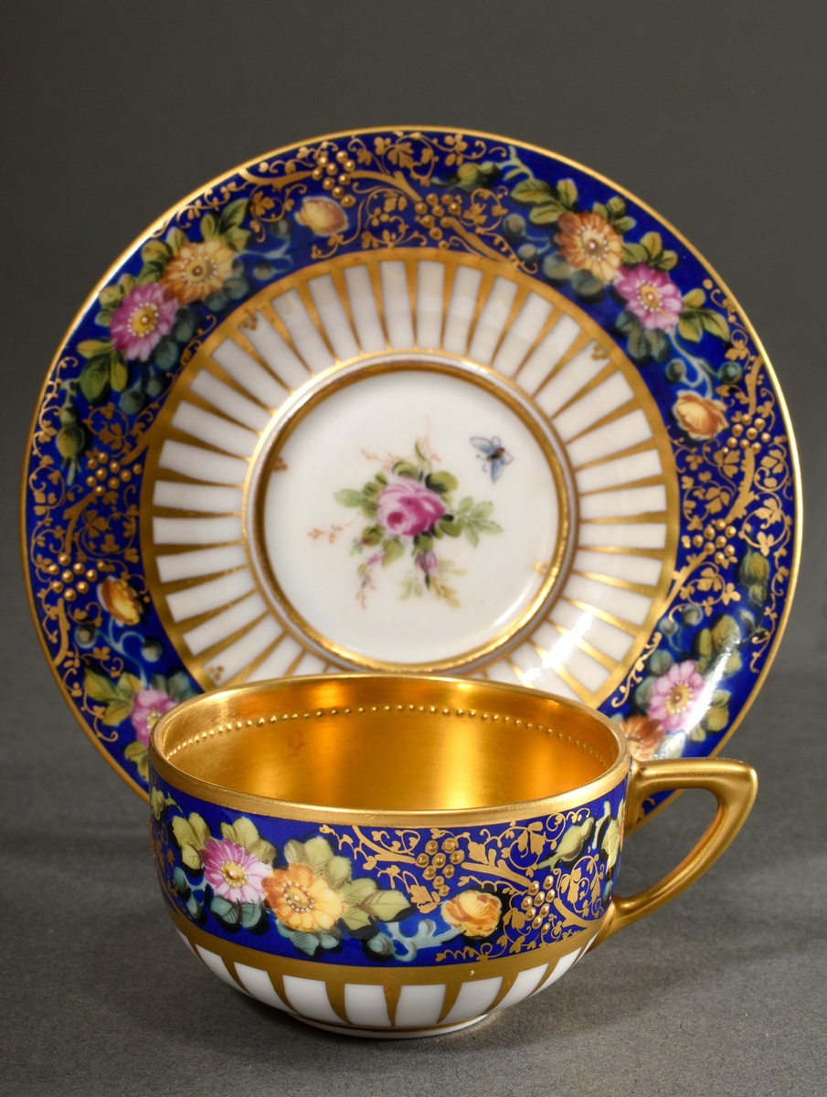 Magnificent demitasse cups/saucers with polychrome floral painting and pastose gold decoration on a