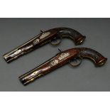 Pair of duelling pistols, percussion lock, rifled octagonal barrel, partly engraved bronze and iron