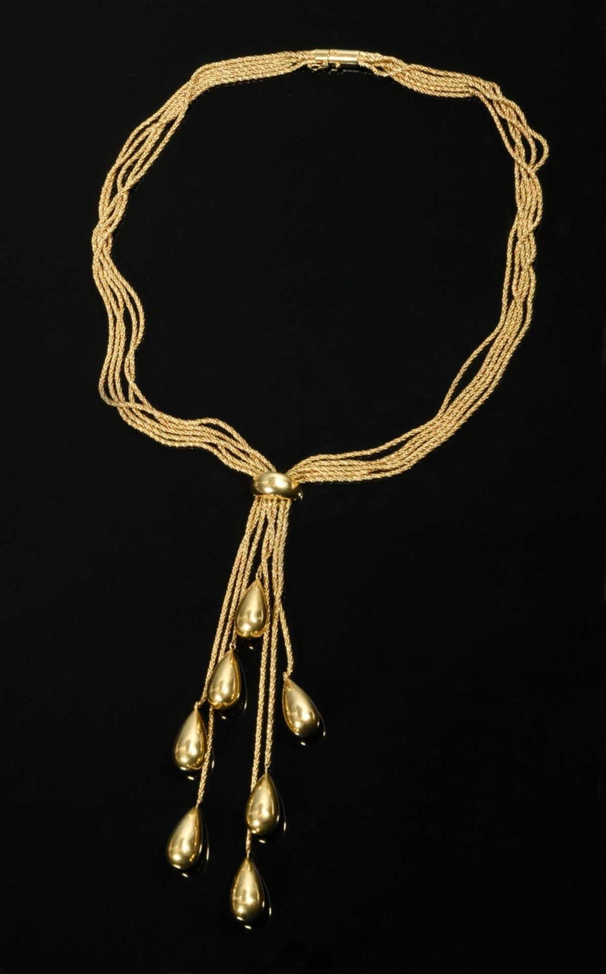 Midcentury yellow gold 750 necklace with 7 drop pendants on chains of different lengths on a 5-stra