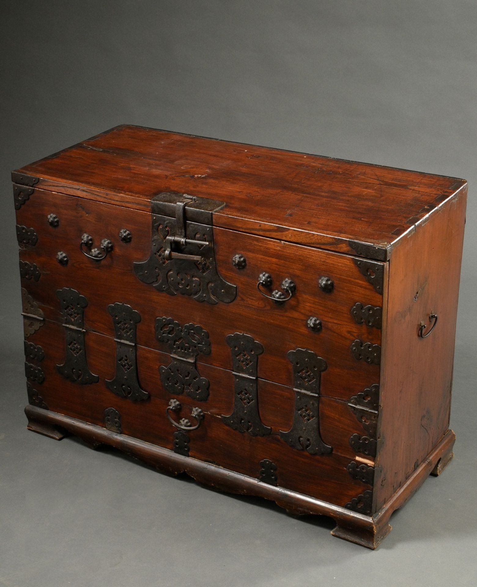 Korean coin chest, dark stained softwood with rich decorative iron fittings, 19th c., 68x95x42.5cm,