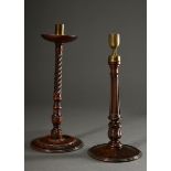 2 Various turned and carved mahogany candlesticks with brass grommets, England 19th century, h. 31.