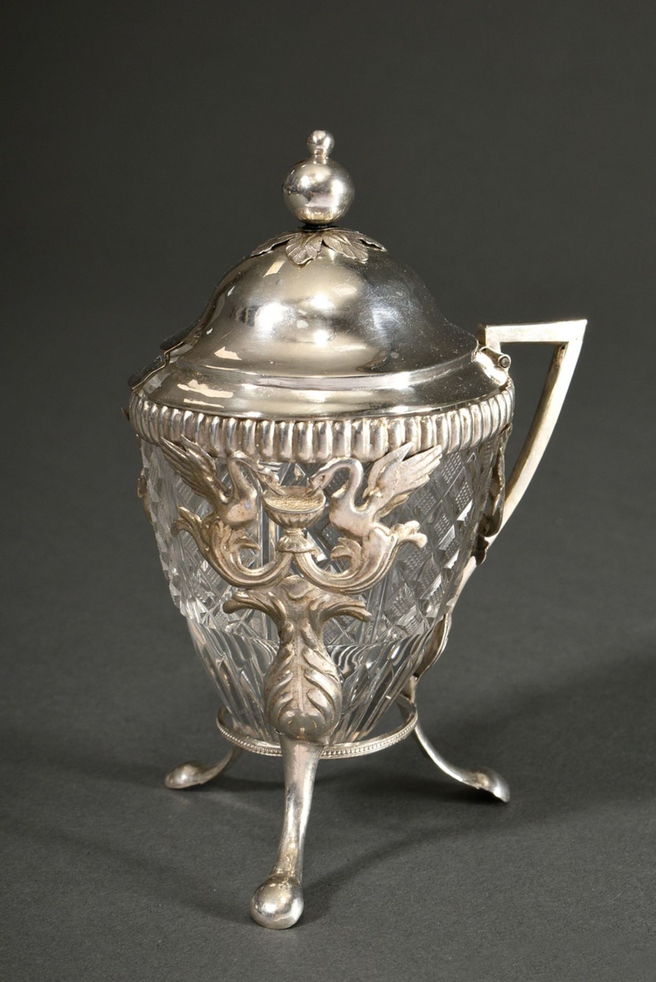 An Empire mustard pot with crystal inset, over 3 feet with swan reliefs, domed hinged lid with ball